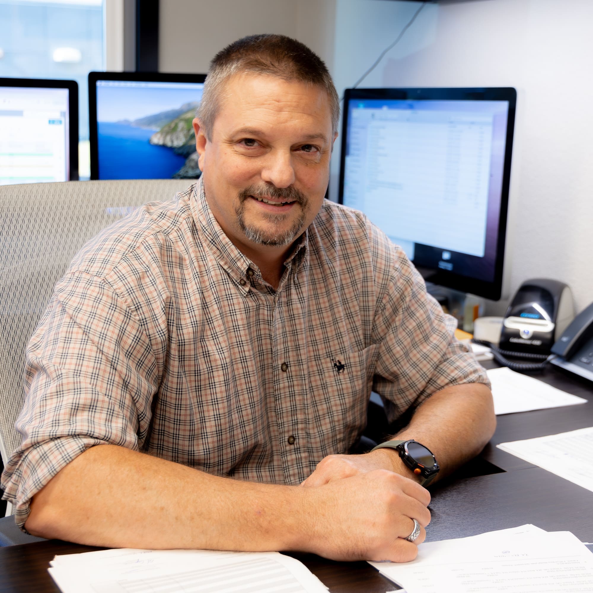 Pacific Foundation Project Manager Sam Slechta Senior Estimator and Project Manager Sam Slechta sits at his desk at Pacific Foundation in Vancouver, WA