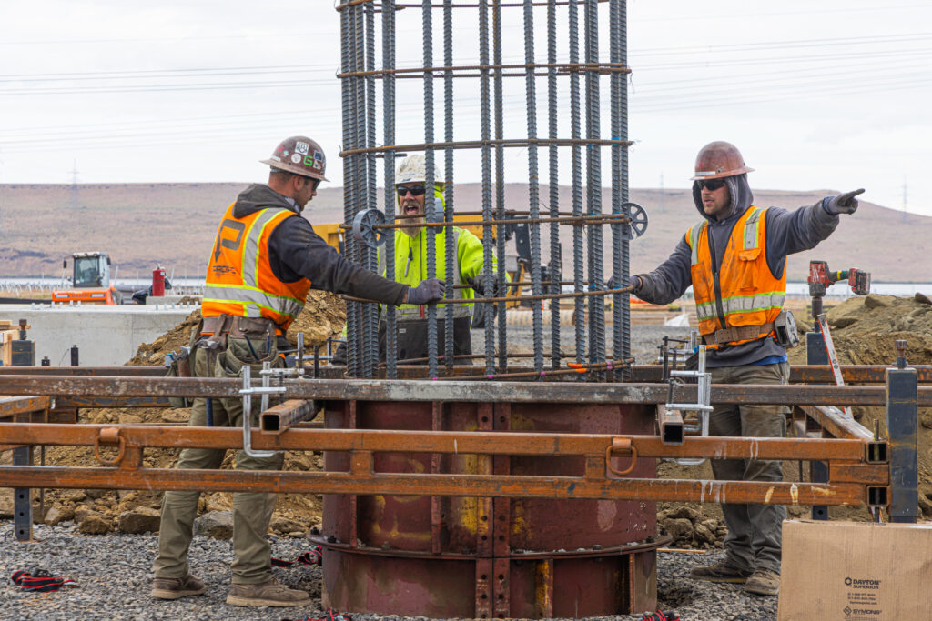 Reinforcing cage being positioned for a drilled shaft at Tower Solar.
