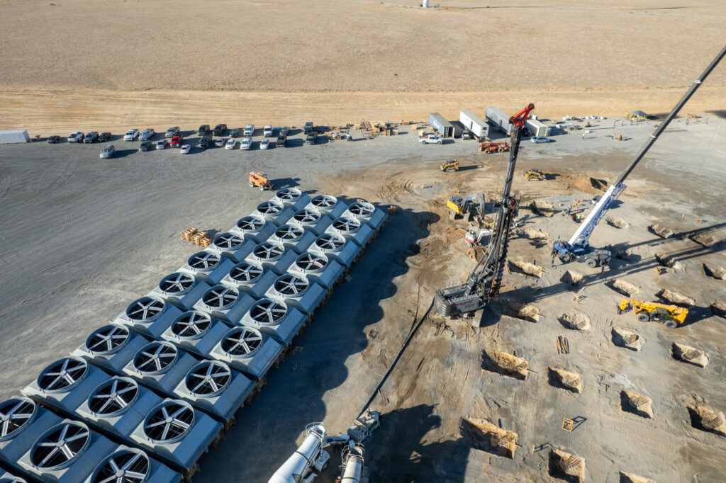 Aerial view of auger cast foundation work beside staged plant equipment at Cape Station Phase II.