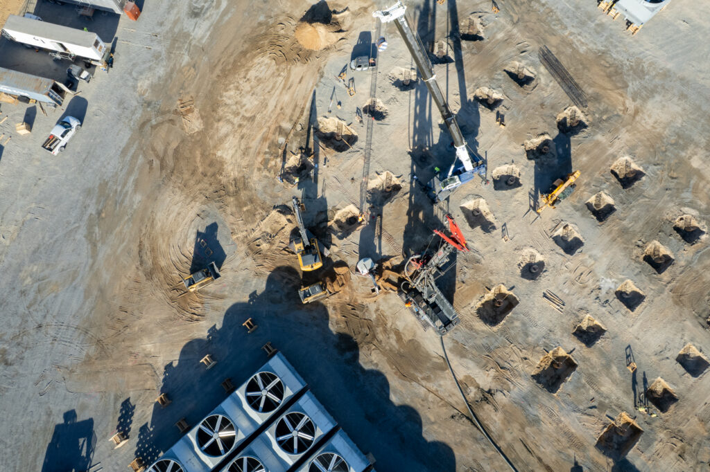 Aerial view of Pacific Foundation installing auger cast piles at Cape Station Phase II.