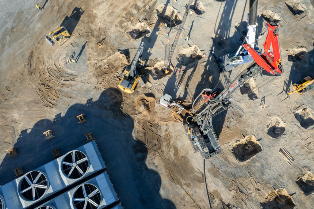 Overhead view of auger cast pile installation and cage placement at Cape Station Phase II.